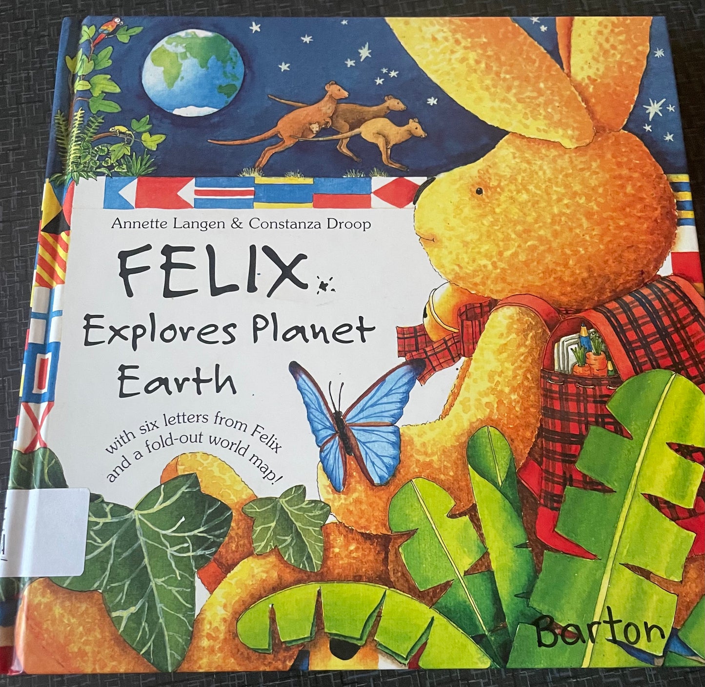 Felix Explores Planet Earth with Other and Map